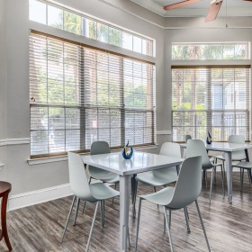 a room with a table and chairs