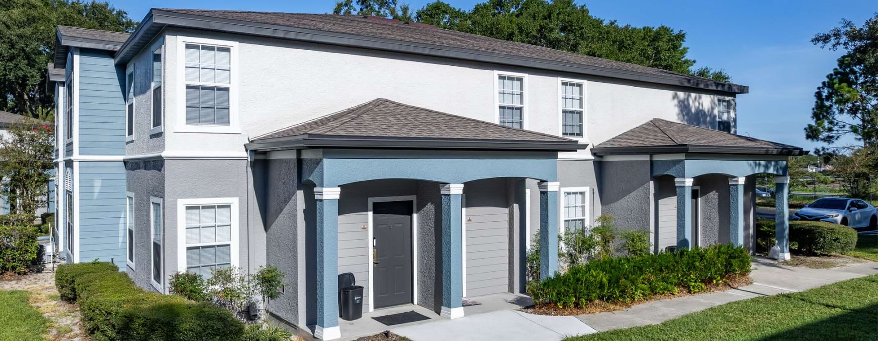 an apartment building with a walkway