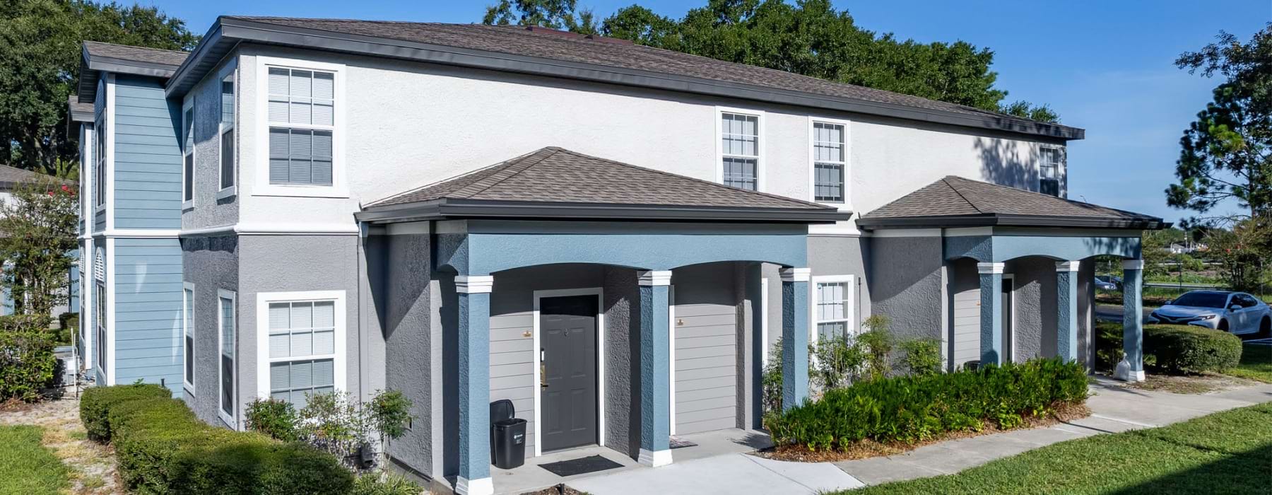 an apartment building with a walkway