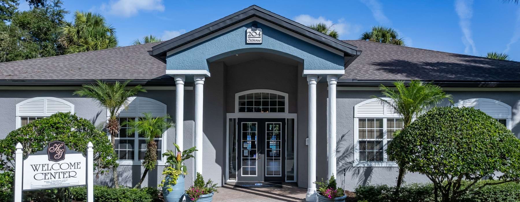 a leasing office with a sign in front