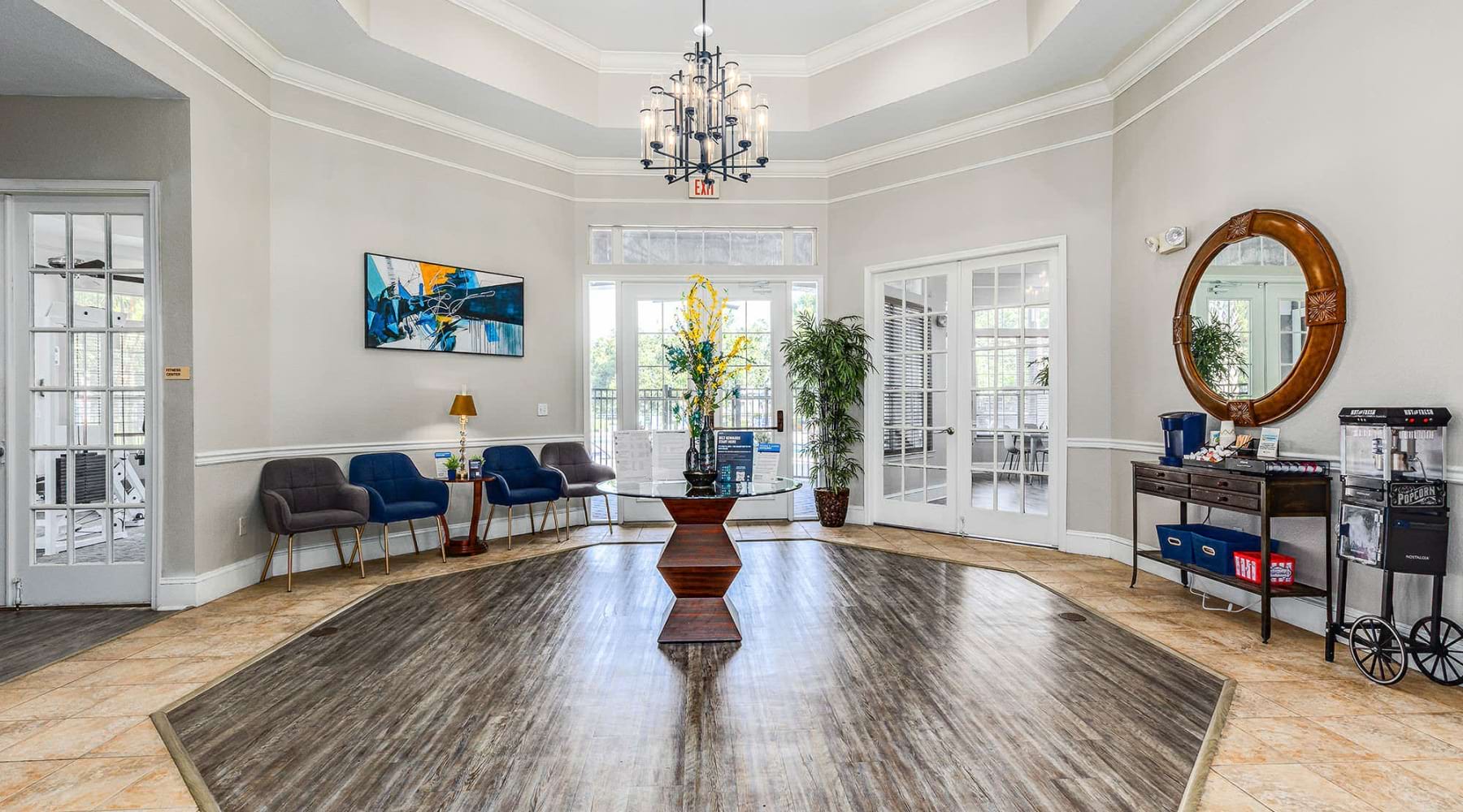 a large room with a large rug and a chandelier